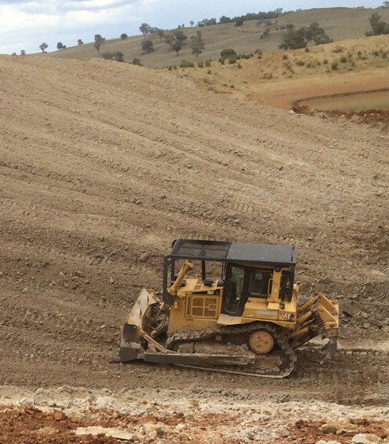 Dozer working in a Large Dam