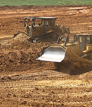 2 Dozers starting a Dam